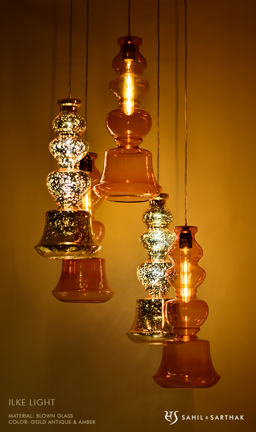 Ilke Lamp in Gold Antique & Amber Blown Glass  by Sahil & Sarthak